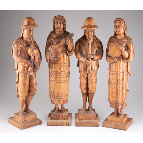 626 - A QUARTET OF 19TH CENTURY OAK FIGURAL CARVINGS, each carved playing a musical instrument. (4) Each a... 