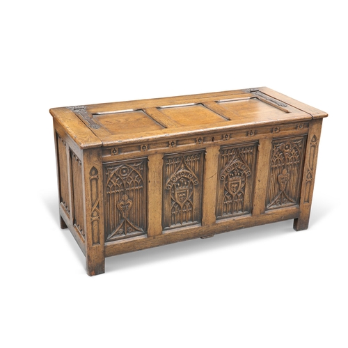 630 - A GOTHIC STYLE OAK COFFER, LATE 19TH CENTURY, the three-panel top with iron strapwork hinges, the fo... 