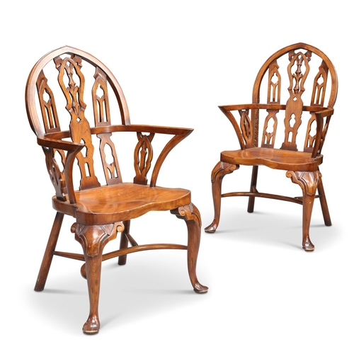 635 - A PAIR OF GOTHIC STYLE STAINED BEECH WINDSOR ARMCHAIRS, each with architectural pointed arch back, r... 