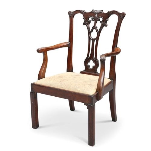 641 - A VICTORIAN MAHOGANY CHILDS CHAIR, IN CHIPPENDALE STYLE, with leafcarved yoked rail above a pierce... 