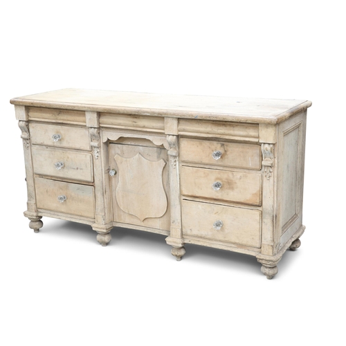 649 - A VICTORIAN PINE DRESSER BASE, fitted with three frieze drawers over a cupboard door flanked by two ... 