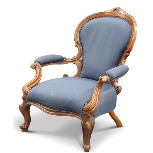 653 - A VICTORIAN WALNUT AND UPHOLSTERED ARMCHAIR, with scroll-carved arms and cabriole legs. Height of ba... 