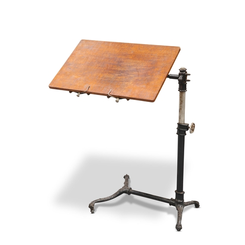 665 - A LATE VICTORIAN CAST IRON AND OAK READING STAND, LABEL OF J. FOOT & SON, LONDON, with rectangular o... 