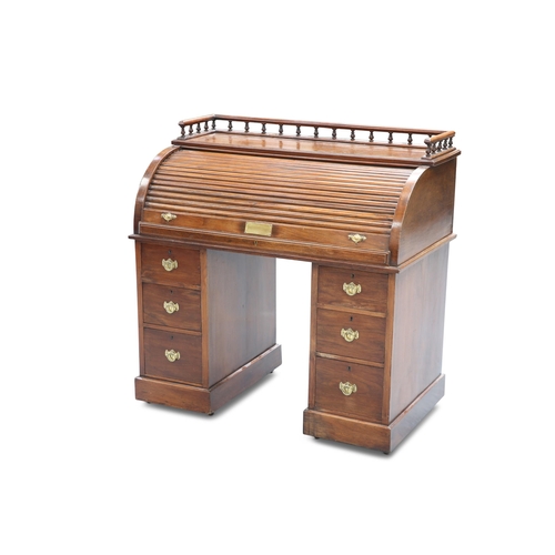 666 - A LATE VICTORIAN MAHOGANY ROLL-TOP DESK, with gallery top above a shutter with presentation plaque d... 