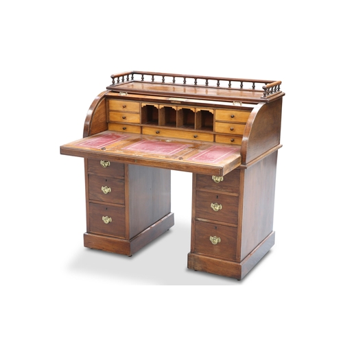 666 - A LATE VICTORIAN MAHOGANY ROLL-TOP DESK, with gallery top above a shutter with presentation plaque d... 