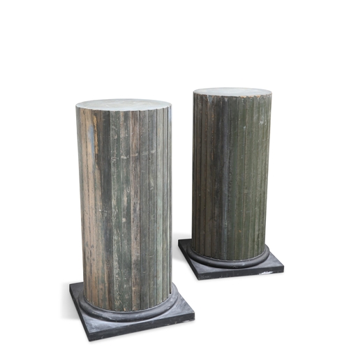 672 - A LARGE PAIR OF PAINTED WOODEN PEDESTALS, each column raised on a square plinth base. (2) 113.5cm hi... 