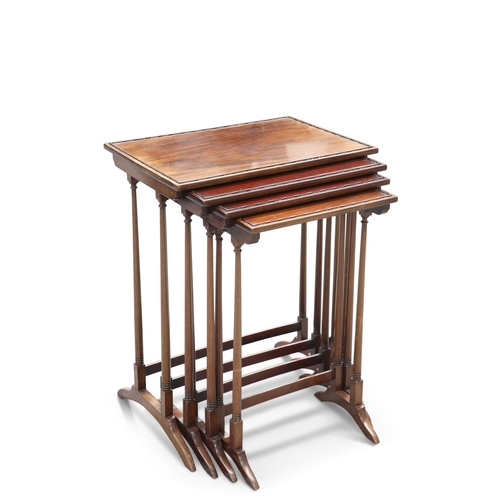 687 - A SET OF EDWARDIAN MAHOGANY QUARTETTO NESTING TABLES, each rectangular top decorated with a beaded b... 