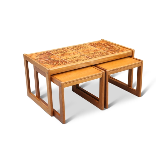 703 - A DANISH NEST OF TEAK TABLES BY TOFTH, DENMARK, the larger table with eight tile top, enclosing a pa... 