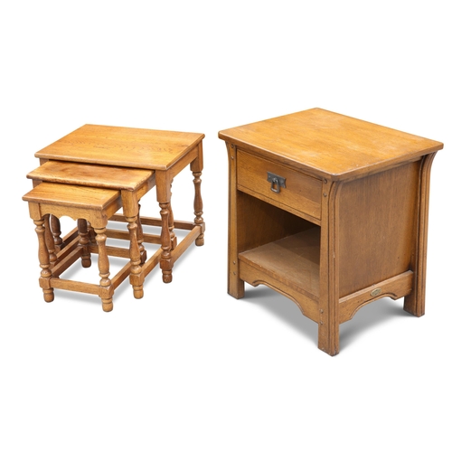 720 - A NEST OF THREE OAK TABLES; together with A CONTEMPORARY OAK BEDSIDE TABLE, with iron handle. (4) Be... 