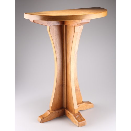 727 - RICHARD COLLINSON, A LABRADORMAN OAK SIDE TABLE, the adzed semi-circular top with burrs, raised abov... 