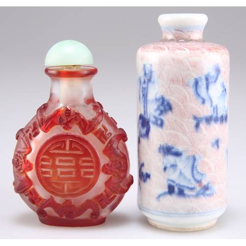 300 - TWO CHINESE SNUFF BOTTLES, comprising A CAMEO GLASS SNUFF BOTTLE, decorated with character symbols w... 