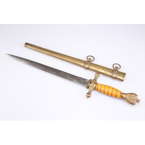 421 - A GERMAN KRIEGSMARINE DAGGER, with orange grip and brass scabbard, the blade engraved 'ALCOSO / SOLI... 