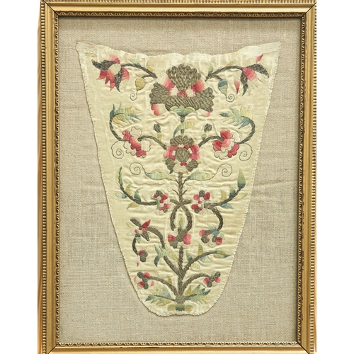 472 - AN 18TH CENTURY NEEDLEWORK STOMACHER, the tapering panel with a floral design, framed. Panel approx.... 