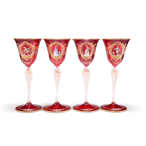 14 - A SET OF THREE VENETIAN RUBY GLASS CHAMPAGNE COUPES, with dish bowls on wrythen baluster stems and d... 