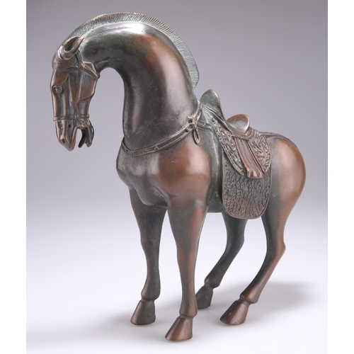 144 - A CHINESE PATINATED BRONZE MODEL OF A TANG STYLE HORSE, modelled in a standing pose with pinned back... 