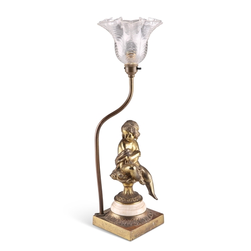 298 - A FRENCH GILT-BRASS FIGURAL TABLE LAMP, CIRCA 1900, with moulded clear-glass shade. 50.5cm high... 