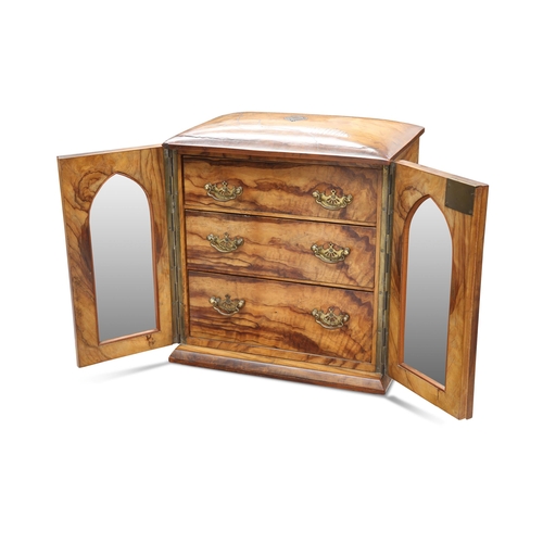 485 - A VICTORIAN WALNUT TABLE CABINET, the glazed doors reveal three graduated drawers with brass handles... 