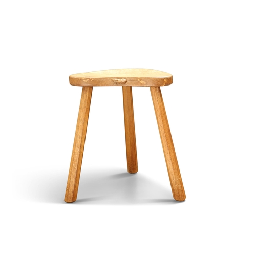 497 - ROBERT THOMPSON OF KILBURN, A MOUSEMAN OAK MILKING STOOL, with a kidney-shaped seat, faceted taperin... 