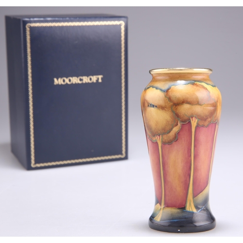 87 - A MINIATURE MOORCROFT EVENTIDE PATTERN VASE, tall baluster form with a gilt rim, printed marks and d... 