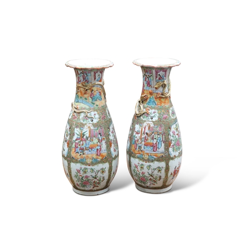 108 - A LARGE PAIR OF 19TH CENTURY CANTONESE FAMILLE ROSE VASES, of baluster form, decorated in the typica... 