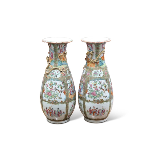 108 - A LARGE PAIR OF 19TH CENTURY CANTONESE FAMILLE ROSE VASES, of baluster form, decorated in the typica... 