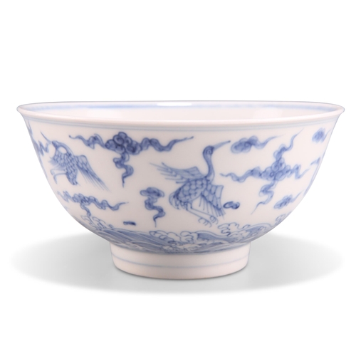 117 - A CHINESE BLUE AND WHITE BOWL, circular, painted in underglaze blue with cranes and clouds over a ro... 