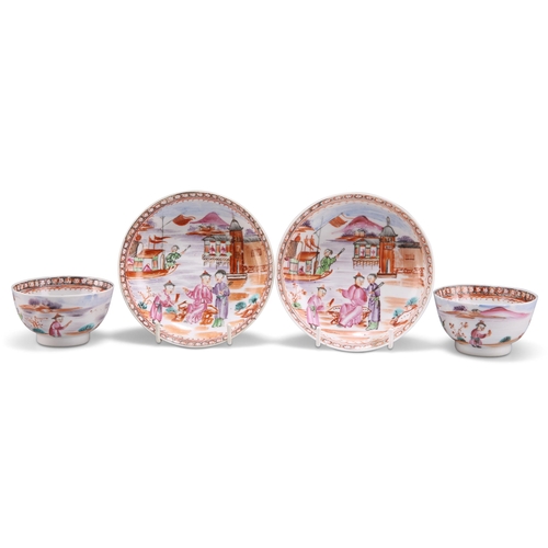 118 - A PAIR OF CHINESE FAMILLE ROSE TEA BOWLS AND SAUCERS, 18TH CENTURY, each painted with figures in a l... 