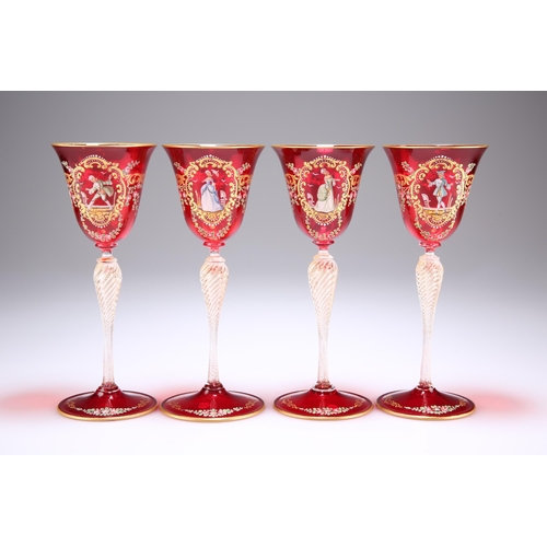 14 - A SET OF THREE VENETIAN RUBY GLASS CHAMPAGNE COUPES, with dish bowls on wrythen baluster stems and d... 