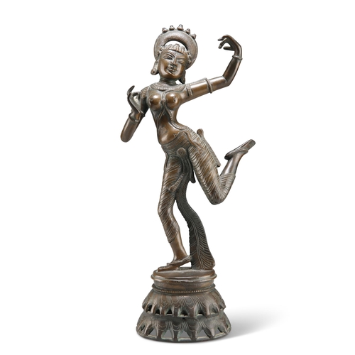 146 - A BRONZE FIGURE OF A DANCING GODDESS, PROBABLY 19TH CENTURY, modelled with her arms and left foot ra... 