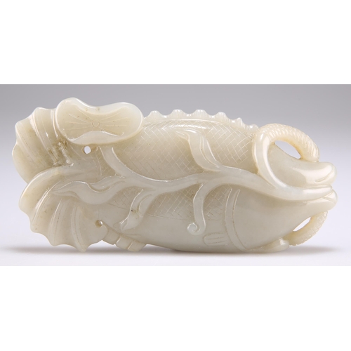 148 - A JADE FISH AND LOTUS CARVING. 13.5cm by 6cm