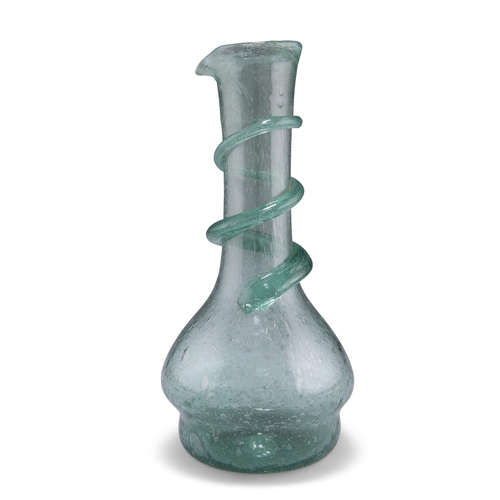 16 - A LIGHT GREEN GLASS CARAFE, LATE 19TH CENTURY, the neck applied with spiral trail, the whole with bu... 