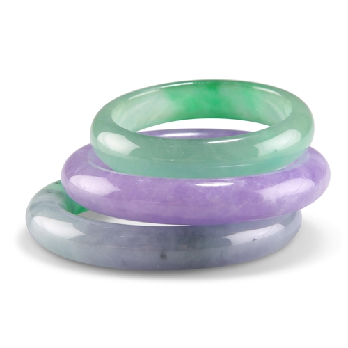 167 - THREE JADE BANGLES, comprising green, blue-green and lilac. (3) 5.5cm, 6.3cm and 6.2cm inner diamete... 