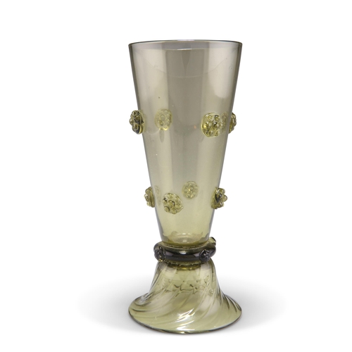 20 - A BOHEMIAN OLIVE GREEN GLASS VASE, CIRCA 1880, the tapering bowl with eight strawberry prunts, raise... 