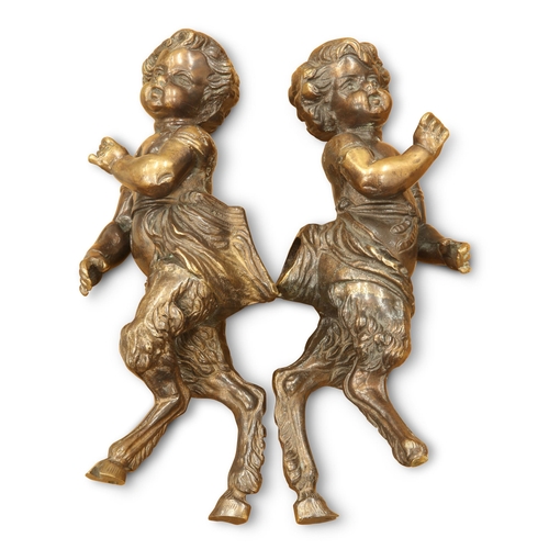 283 - A PAIR OF BRONZE FIGURES OF PUTTI, each cast hooved. (2) 25cm high