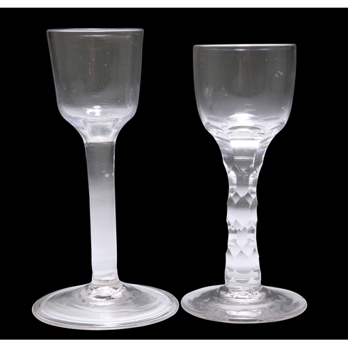 4 - AN 18TH CENTURY PLAIN STEM WINE GLASS, the ogee bowl above a plain stem and folded foot, 15cm high; ... 