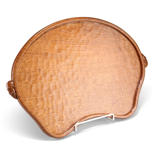 495 - ROBERT THOMPSON OF KILBURN, A VINTAGE MOUSEMAN OAK TRAY, kidney-shaped, with twin mouse handles, adz... 