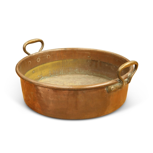 51 - A LARGE VICTORIAN COPPER CREAM PAN, circular with brass handles. 51.5cm across handles... 