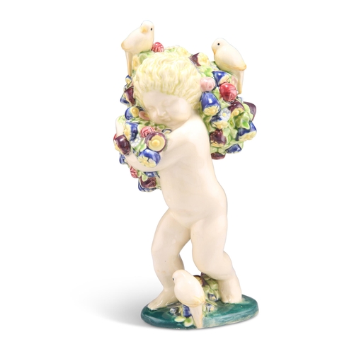 75 - MICHAEL POWOLNY FOR WIENER KERAMIK, AN EARTHENWARE FIGURE, modelled as a cherub holding many flowers... 