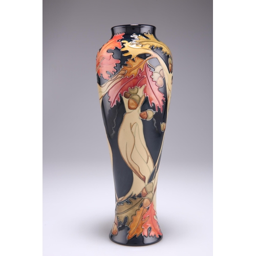 80 - A MOORCROFT LIMITED EDITION WOOD NYMPH PATTERN TUBE LINED POTTERY VASE, 117/150, designed by Kerry G... 