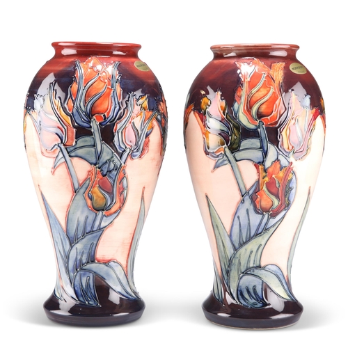 84 - A PAIR OF MOORCROFT LARGE POTTERY VASES, of baluster form, tubelined and hand-painted with Sally Tuf... 