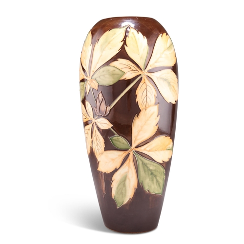 89 - A WALTER MOORCROFT LARGE POTTERY VASE, baluster form, 'Chestnut Leaves' pattern, tubelined and hand-... 