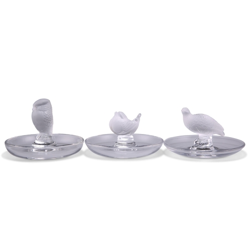 9 - LALIQUE - THREE GLASS PIN DISHES, clear moulded glass, frosted and polished, including a grouse, owl... 