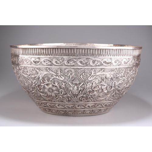 1016 - A 19TH CENTURY INDIAN SILVER BOWL, OF HUGE PROPORTIONS Kutch, c.1880, circular, the deep sides and b... 