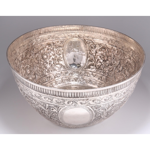 1016 - A 19TH CENTURY INDIAN SILVER BOWL, OF HUGE PROPORTIONS Kutch, c.1880, circular, the deep sides and b... 