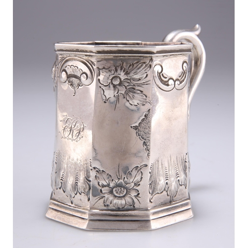 1019 - A 19TH CENTURY SILVER MUG possibly American, c.1850, octagonal, embossed with flowerheads and C-scro... 