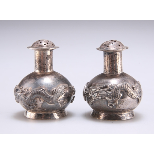 1030 - A PAIR OF 19TH CENTURY CHINESE SILVER PEPPER POTS retailed by Kwan Wo, Hong Kong, artisan mark of Sh... 