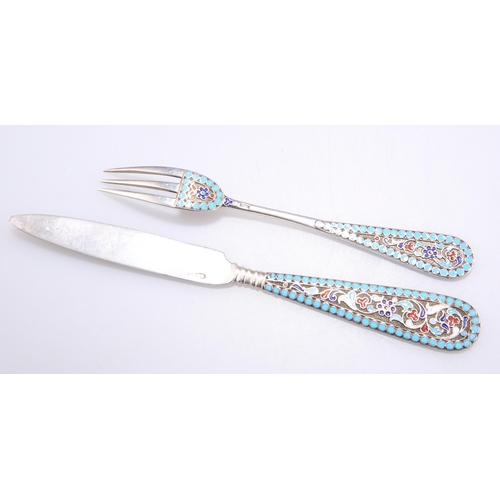 1038 - A RUSSIAN SILVER AND ENAMEL KNIFE AND FORK Second Kokoshnik mark, Moscow, each handle picked out wit... 