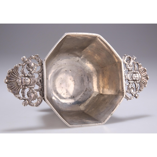 1058 - A DUTCH SILVER BRANDY BOWL apparently unmarked, octagonal on a spreading foot with openwork flat han... 