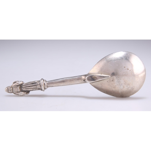 1064 - A CONTINENTAL SILVER SPOON indistinct marks, with a columnar stem surmounted by a figural terminal. ... 