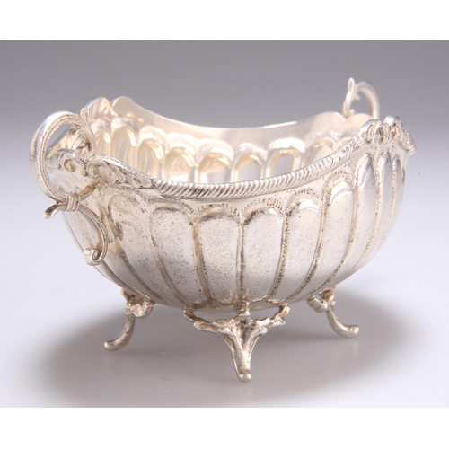 1072 - A CONTINENTAL SILVER TWO-HANDLED BON-BON DISH with reeded body and pierced scroll feet. 16cm wide, 3... 